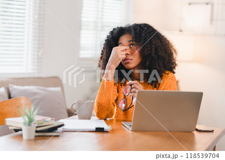 Tired African American Woman at Laptop Rubbing Eyes 118539704