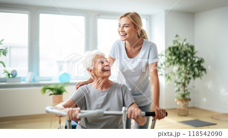 A medical professional engages in therapeutic exercises with an elderly woman in a wheelchair, utilizing a ball and various aids, exemplifying compassionate care and rehabilitation support in the 118542090