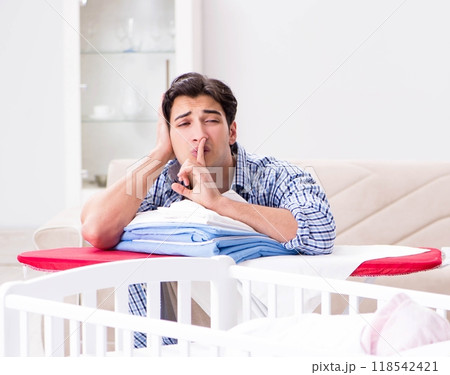 Young dad looking after newborn baby 118542421