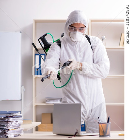 Professional contractor doing pest control at office Professional contractor doing pest control at office 118542991