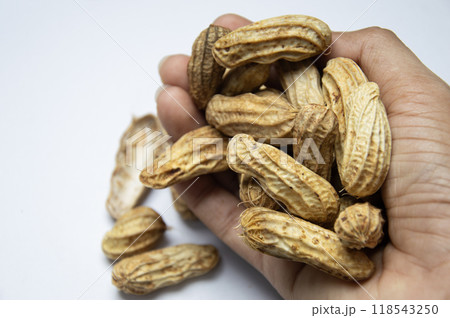 Peanuts are a natural source of protein and are popularly eaten around the world. 118543250