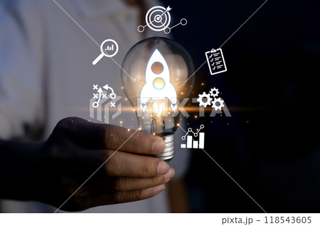 Rocket launch idea inside lightbulb. strategically planning and initiating a corporate startup. aim to achieve objectives through value development, fostering leadership 118543605