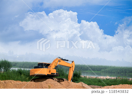 Excavators are working in open areas. Excavators are working in open areas. 118543832