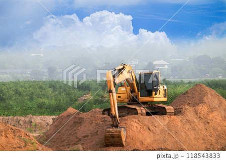 Excavators are working in open areas. Excavators are working in open areas. 118543833