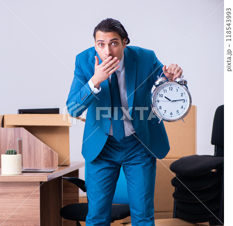 Young handsome businessman being fired from his work Young handsome businessman being fired from his work 118543993