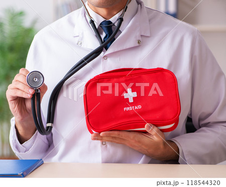 Male doctor with first aid bag Male doctor with first aid bag 118544320