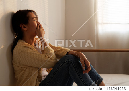 Depressed young asian woman with mental health problem in mind need crucial treatment from overthinking fatigue girl, disruptive thought, dissocial, anxiety and mental health disorders. 118545038