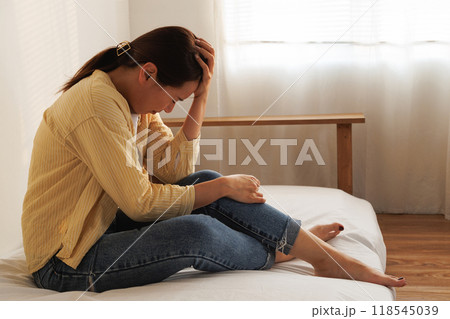 Depressed young asian woman with mental health problem in mind need crucial treatment from overthinking fatigue girl, disruptive thought, dissocial, anxiety and mental health disorders. 118545039