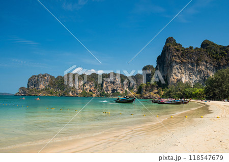 Railay beach with tourist boat and limestone mountain, Krabi, Thailand 118547679