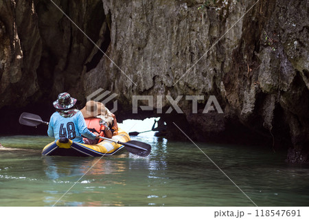 Tourist on canoe go through Tham Lod or grotto cave, Phang Nga 118547691