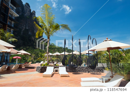 sunbath bedchair at swimming pools of hotel in Ao Nang, Krabi 118547694