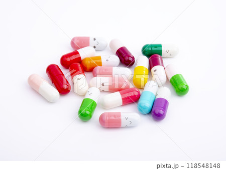 Different color pills on white background Different color pills on white background 118548148
