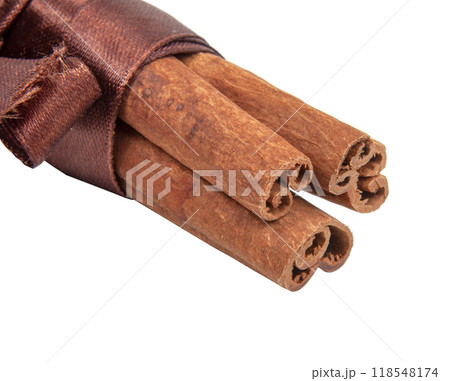 Dried sticks of cinnamon natural spices on white isolated Dried sticks of cinnamon natural spices on white isolated 118548174
