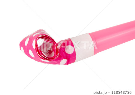 Rolled festive noisemaker or party whistle horn on the white 118548756