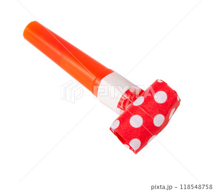 Rolled festive noisemaker or party whistle horn on the white 118548758