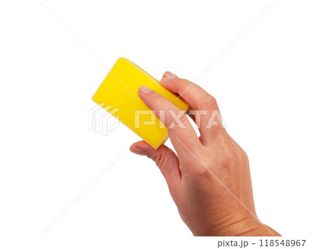 Sponge for washing dishes in hand isolated on the white 118548967