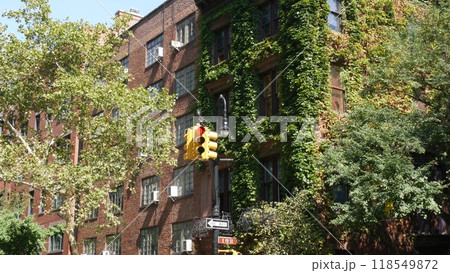 New York City street crossroad, yellow traffic light, transport road intersection, United States. 118549872