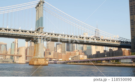 New York City Manhattan Bridge to Brooklyn. Waterfront downtown skyline cityscape, river Pier 35. New York City Manhattan Bridge to Brooklyn. Waterfront downtown skyline cityscape, river Pier 35. 118550090
