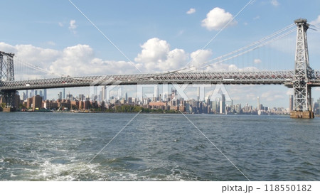 New York City skyline from ferry boat. Manhattan midtown, East river, Williamsburg Bridge, USA. 118550182