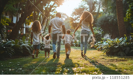 A family playing in a park together. 118551285
