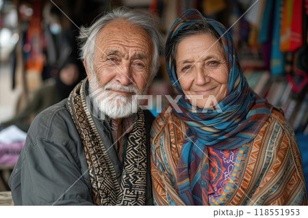 Elderly couple in traditional attire sitting together Elderly couple in traditional attire sitting together 118551953