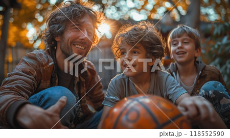 A family playing sports together in the backyard. A family playing sports together in the backyard. 118552590