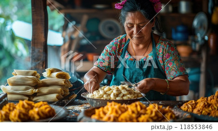 A family making tamales together in a kitchen. 118553846