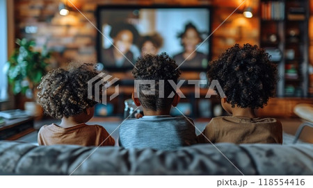 A family enjoying a movie night at home. 118554416