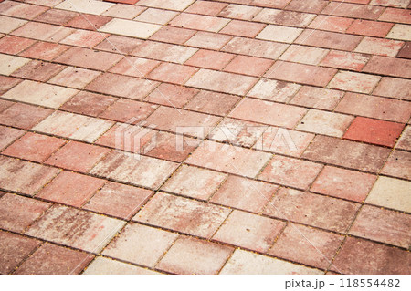 A detailed closeup view of a red and white colored brick pavement 118554482