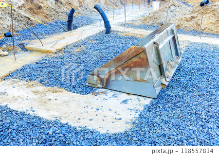Preparation ground foundations installation formwork for pouring of concrete at a construction site for building Preparation ground foundations installation formwork for pouring of concrete at a construction site for building 118557814