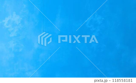 The image is a solid blue color with some faint white 118558181