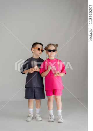 Little couple kids boy girl 4-5 years old clothes shirt dress posing have fun isolated on white background children studio portrait. People childhood lifestyle Little couple kids boy girl 4-5 years old clothes shirt dress posing have fun isolated on white background children studio portrait. People childhood lifestyle 118560207