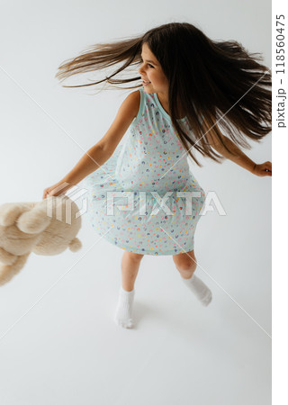 Full length cute little girl in pajama Full length cute little girl in pajama 118560475