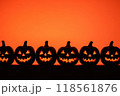 eerie jack-o'-lanterns with glowing faces against a fiery orange background, depicting a classic Halloween scene 118561876