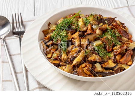 fried blend of wild mushrooms in a bowl 118562310