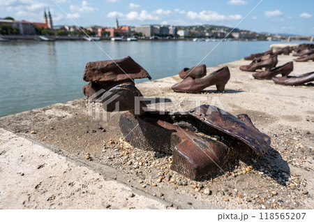 Budapest, Hungary. 25 August 2022. Memorial to the victims of the Nazi repression. Rusty metal copies of old shoes on the Danube River embankment. Holocaust and Nazi terror memory concept. 118565207