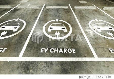 Empty space of EV charge parking lots in a business building, sign of EV charge on the ground of parking lots. 118570416