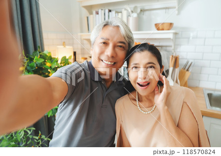 Happy, love and a senior Asian couple with a selfie for a memory Happy, love and a senior Asian couple with a selfie for a memory 118570824