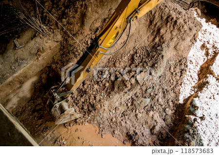 A significant pile of ground is being excavated by a bulldozer 118573683