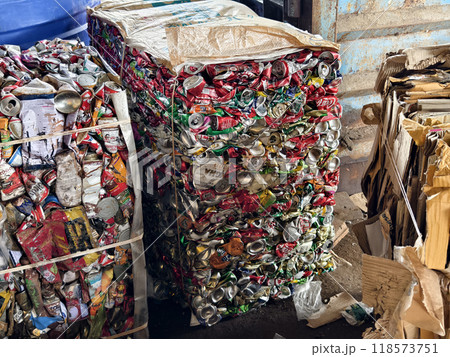There is a large pile of crushed aluminum cans stacked on top of each other at the landfill. There is a large pile of crushed aluminum cans stacked on top of each other at the landfill. 118573751