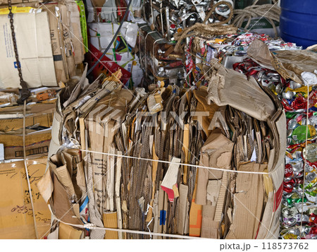 A large pile of cardboard in a big landfill A large pile of cardboard in a big landfill 118573762