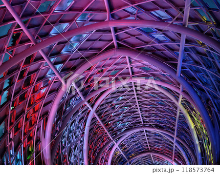 A stunning tunnel with vibrant purple and blue ceiling lights 118573764