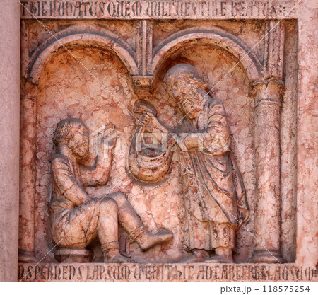Christ Performing Works of Mercy relief at the baptistry from Benedetto Antelami, Parma, Emilia Romagna, Italy 118575254