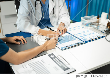 Medical team working on digital tablet healthcare doctor technology tablet using computer analyzed the results of medical reports at the hospital. 118576187