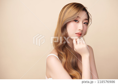 Beautiful young asian woman with clean fresh skin on beige background, Face care, Facial treatment, Cosmetology, beauty and spa, Asian women portrait. Beautiful young asian woman with clean fresh skin on beige background, Face care, Facial treatment, Cosmetology, beauty and spa, Asian women portrait. 118576986