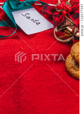 note to Santa on a red background with bells and cookies, Christmas concept 118577347