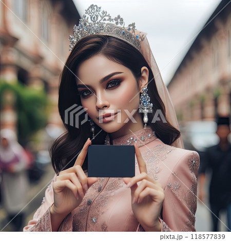 Young islamic(muslimah) girl with traditional clothing holding blank sign with Generative AI. 118577839