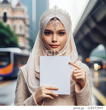 Young islamic(muslimah) girl with traditional clothing holding blank sign with Generative AI. 118577847