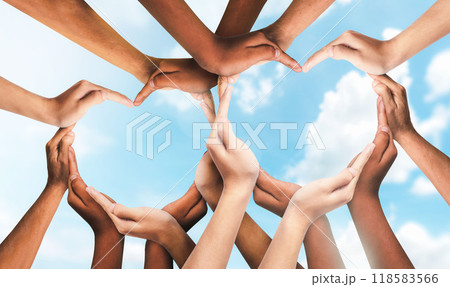 Unity and diversity are at the heart of a diverse group of people connected together as a supportive symbol that represents a sense of and togetherness. Symbol and shape created from hands. 118583566