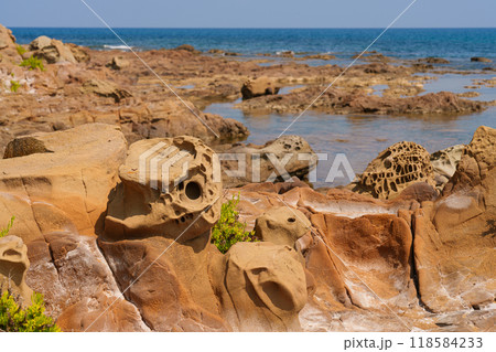 Eroded Coastal Rocks with Intricate Natural Patterns Eroded Coastal Rocks with Intricate Natural Patterns 118584233
